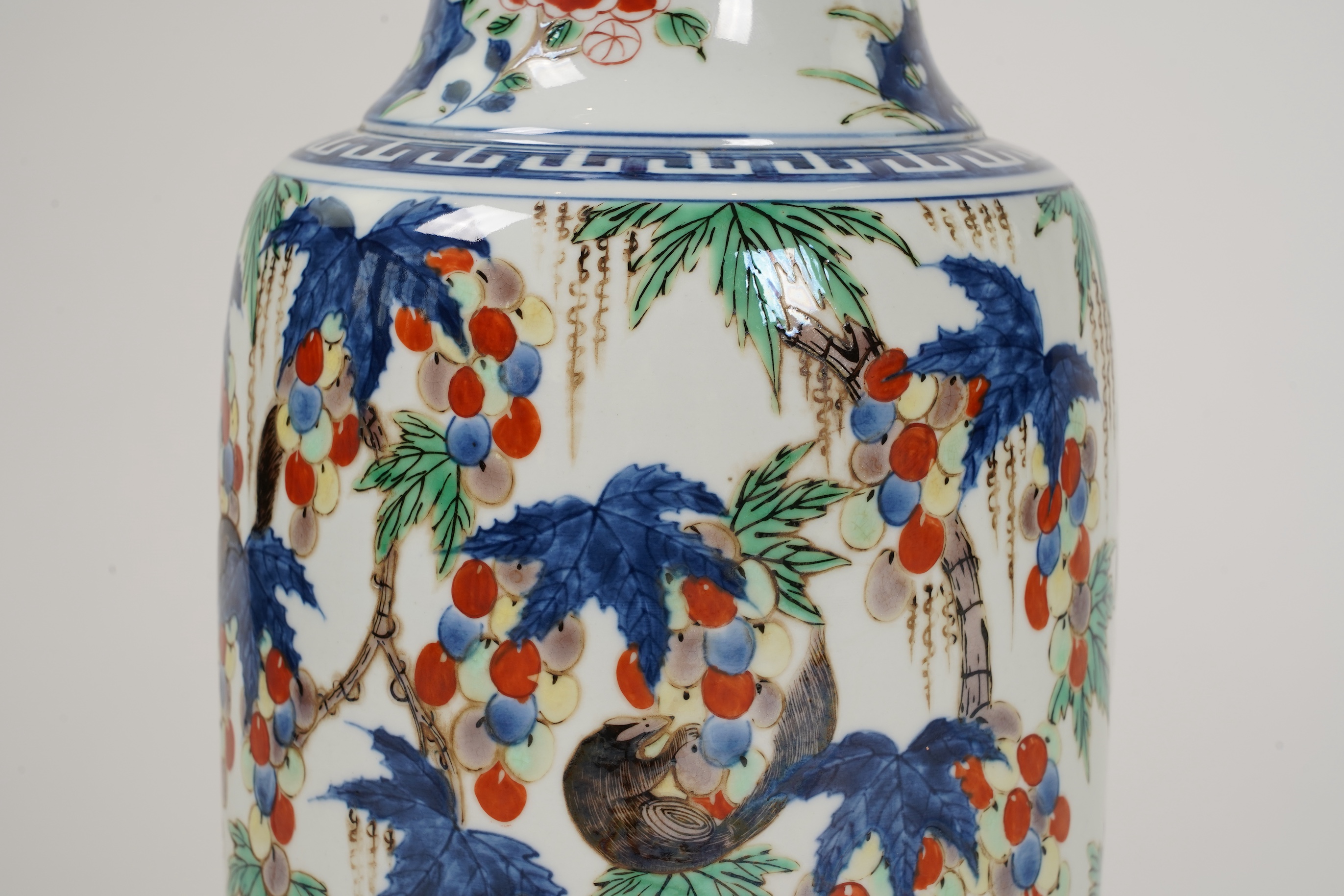 A Chinese wucai ‘squirrel and grapevine’ sleeve vase, Kangxi style